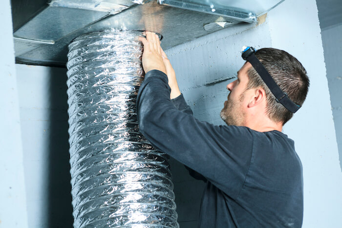 man working on ducts